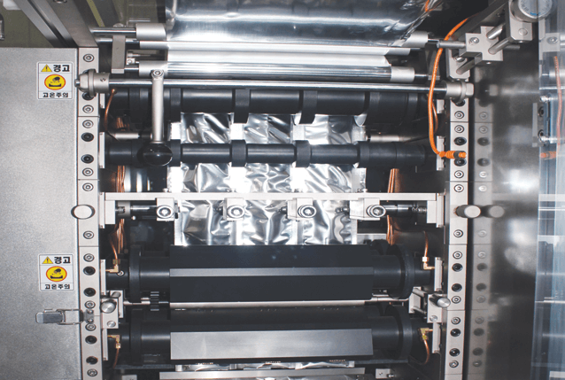 液體包裝機 HSL-201- 立式封口滾筒- 隆典科技